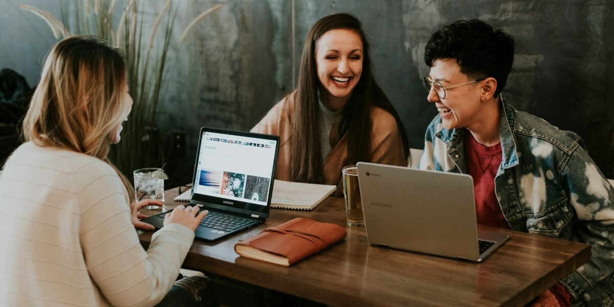 People learning together on laptops
